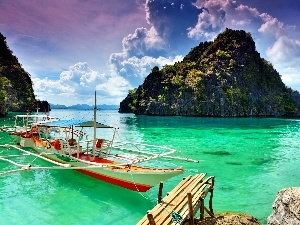 Boat, rocks, clouds, sea