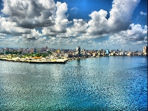 Town, clouds, sea