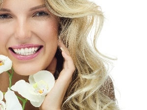 Blonde, orchids, smiling