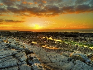 Stones, sun, sea, west