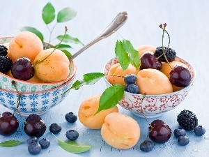 Bowls, cherries, apricots, blueberries