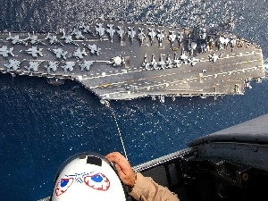 Planes, soldier, aircraft carrier